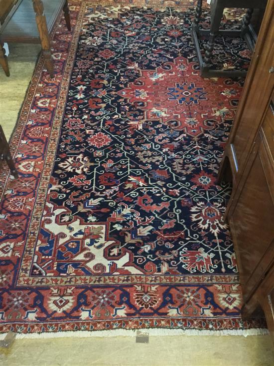 Red & blue ground Heriz carpet, 10ft 9in by 7ft 5in(-)